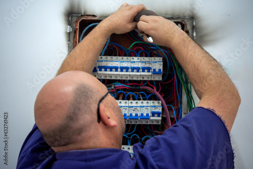 Electrician repairing burnt electrical connection