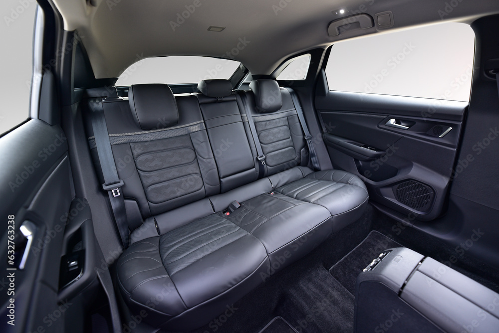 Car interior, black leather rear seat in the passenger car