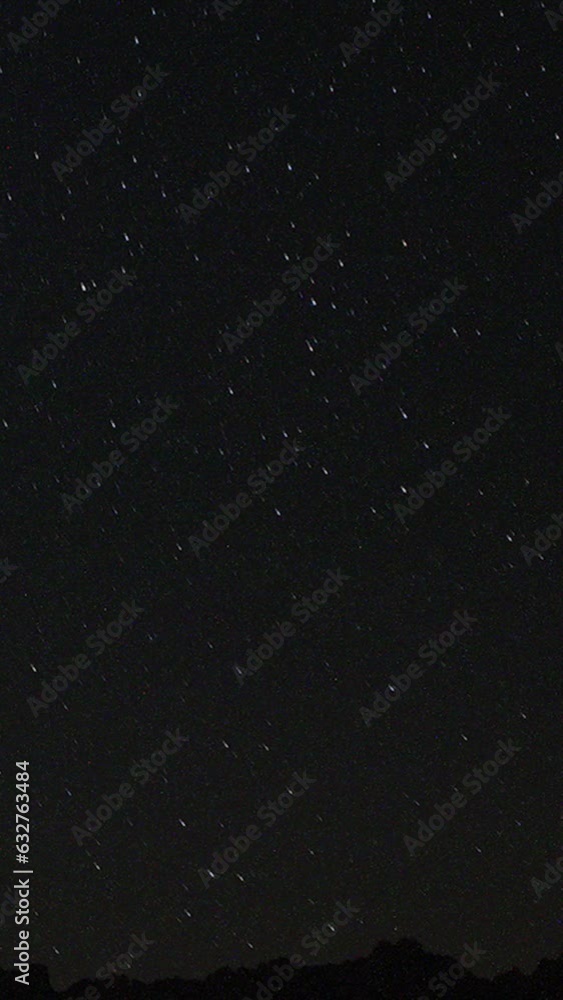 A view of the stars of the Milky Way with a mountain top in the foreground. Night sky nature summer landscape. Perseid Meteor Shower observation. Vertical video for social media. A view of the stars of the Milky Way with a mountain top in the foreground. Night sky nature summer landscape. Perseid Meteor Shower observation. Vertical video for social media.
