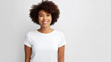 portrait of an attractive afro american female in her 30s with a short brown curly hair isolated against a white background