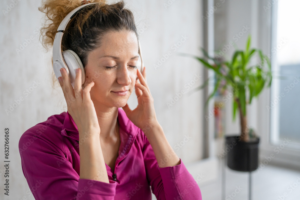 one woman doing guided meditation yoga self care practice at home one woman doing guided meditation yoga self care practice at home