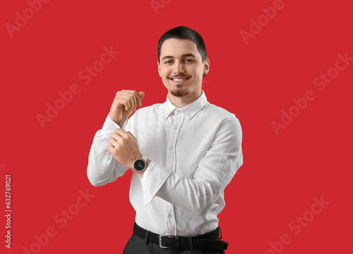 Young businessman rolling u...