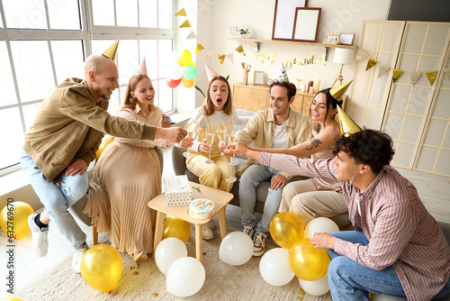 Happy young adult friends t...