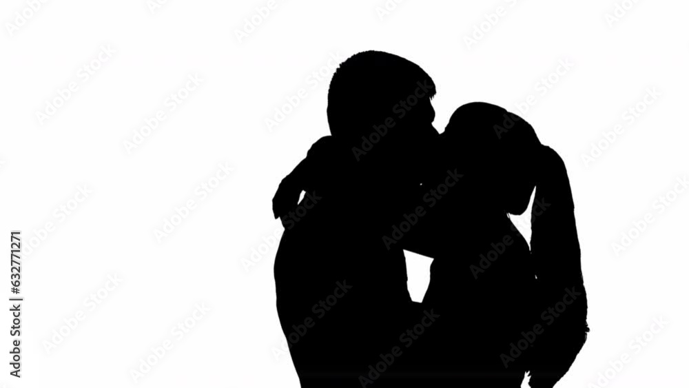 Silhouette of a kissing couple of a man with a woman. black and white mask Silhouette of a kissing couple of a man with a woman. black and white mask
