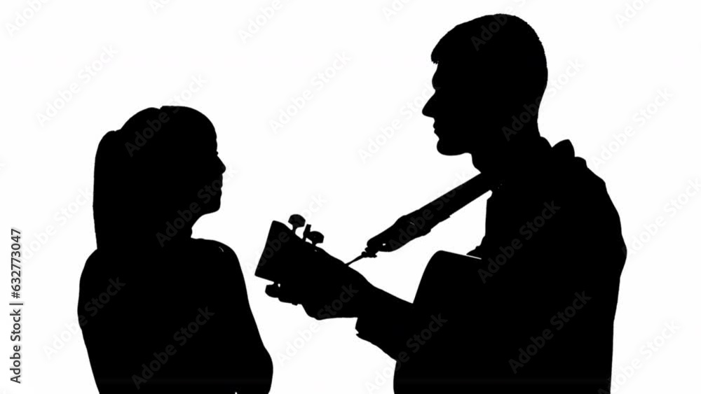 Silhouette of a girl with a guy playing the guitar. black and white mask