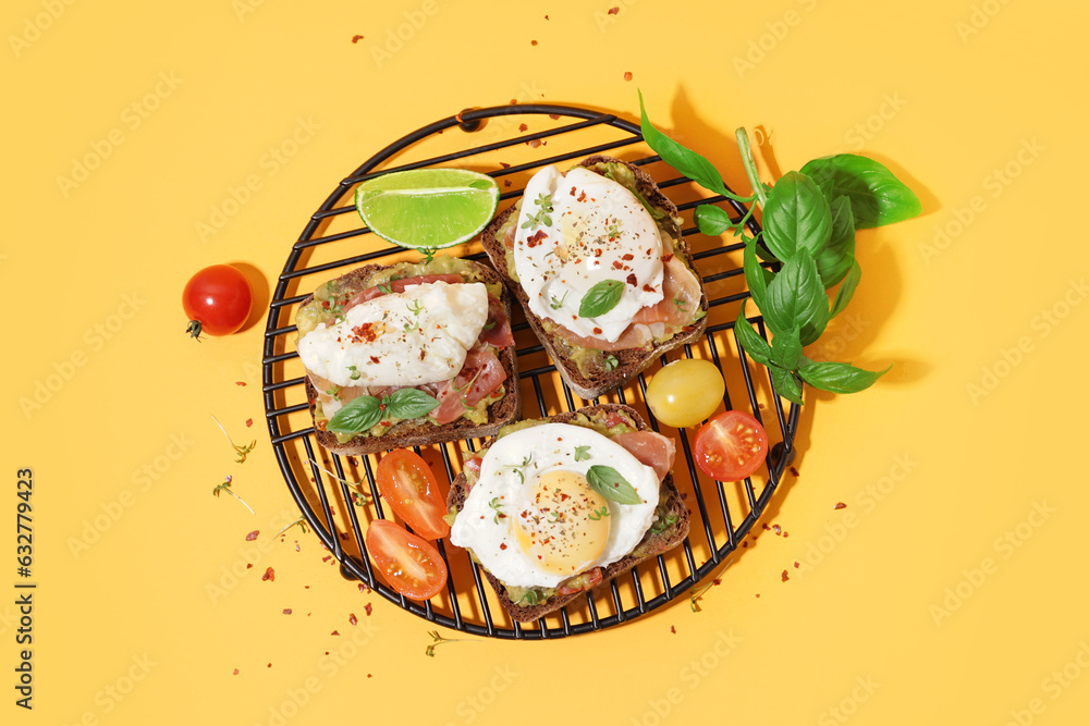 Grid of tasty sandwiches with egg on yellow background Grid of tasty sandwiches with egg on yellow background