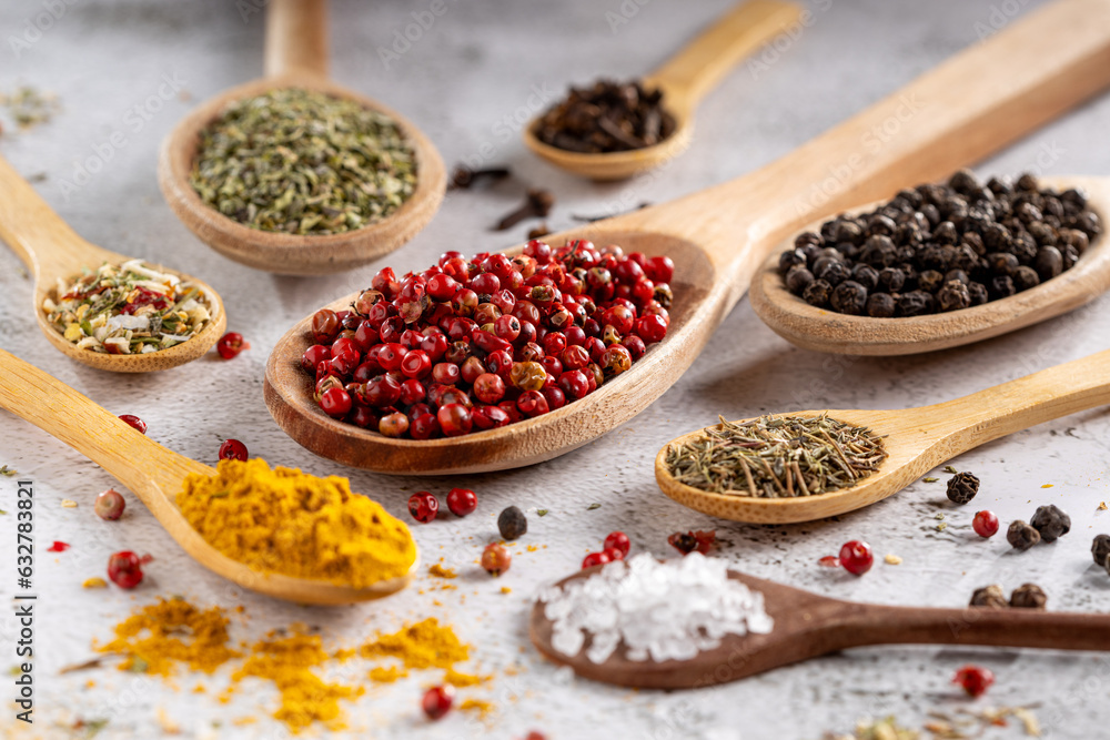 Various spices and seasonings in wooden spoons. Various spices and seasonings in wooden spoons.