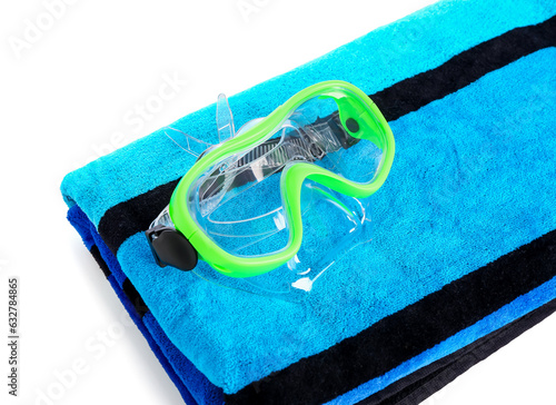 New swimming mask and towel on white background