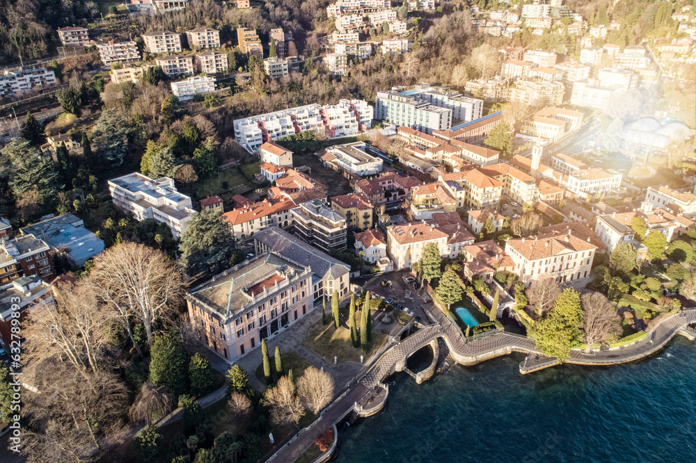 Aerial view of the cityscape of  Como at sunrise with villas and traditional houses