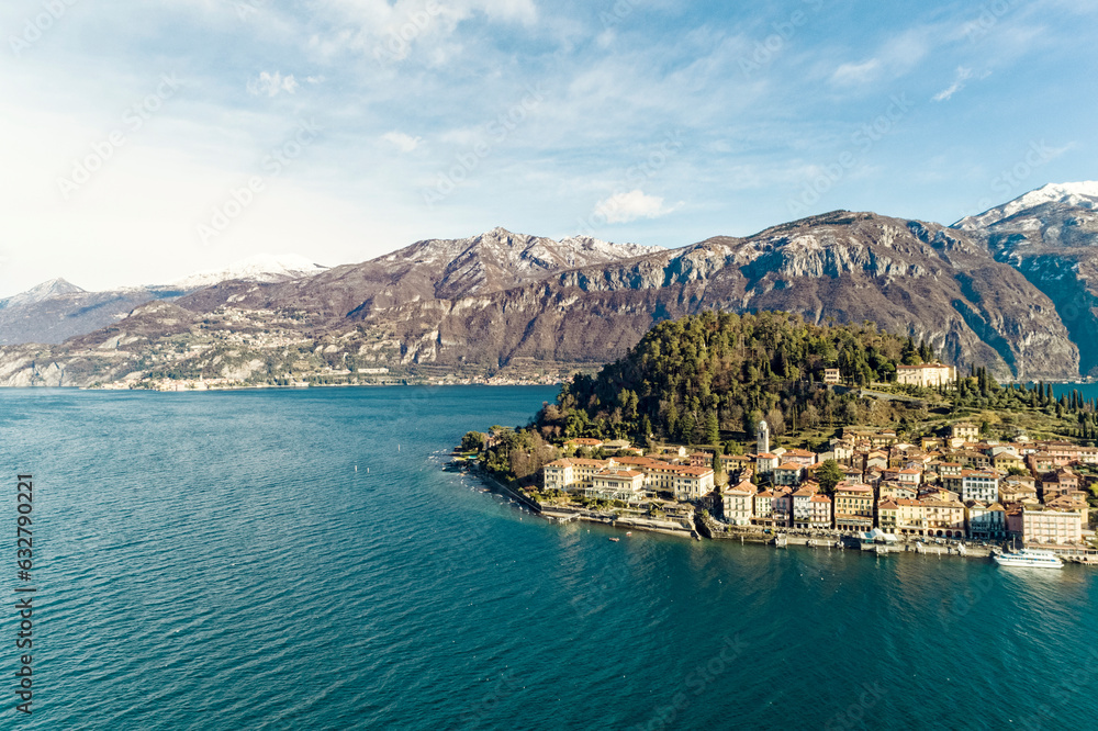 Aerial view of  Bellagio village on Como lake with blue sky and the Alps in the background, Bellagio, Como, Italy