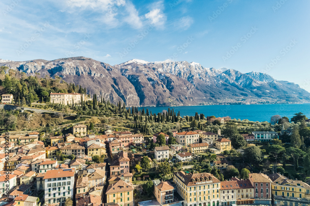 Aerial view of  Bellagio village on Como lake with blue sky and the Alps in the background, Bellagio, Como, Italy