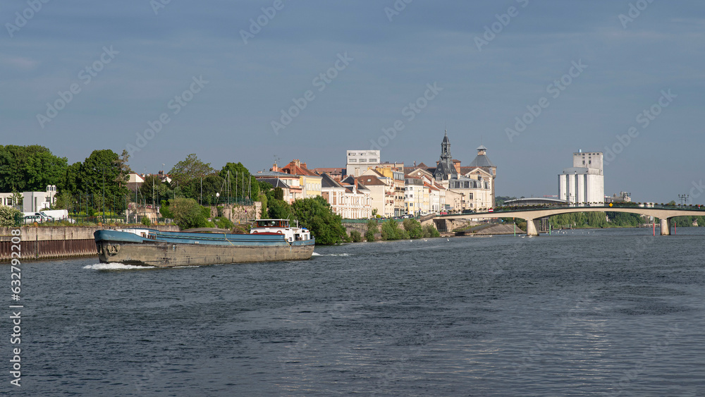 Naklejka premium A barge on the Seine in the town of Corbeil-Essonnes in the Paris region of France 