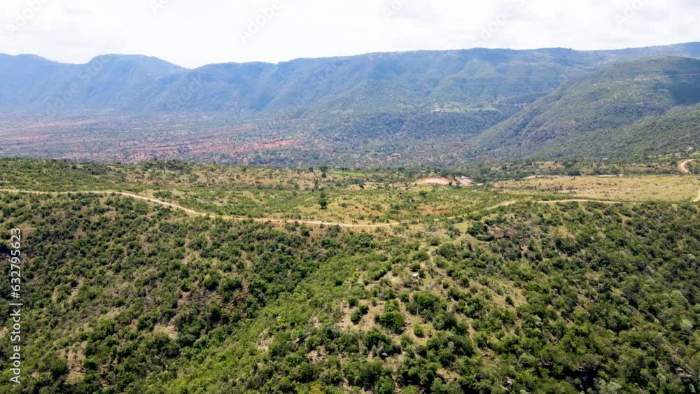Africa view from drone. Birdseye aerial view of rural settlement of West pokot Kenya, shanty poor neighborhood of West pokot, Kenya. sparsely populated area without running water and electricity. Africa view from drone. Birdseye aerial view of rural settlement of West pokot Kenya, shanty poor neighborhood of West pokot, Kenya. sparsely populated area without running water and electricity.