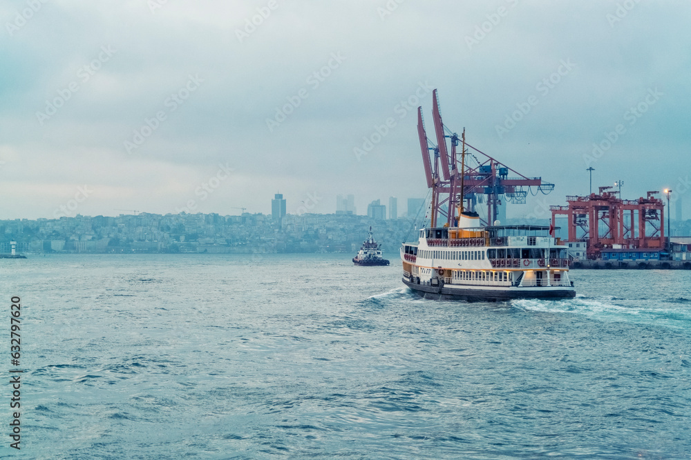 Ferry in the bosphorus in Istanbul with the harbor in the background, by sunset, Istanbul, Turkiye