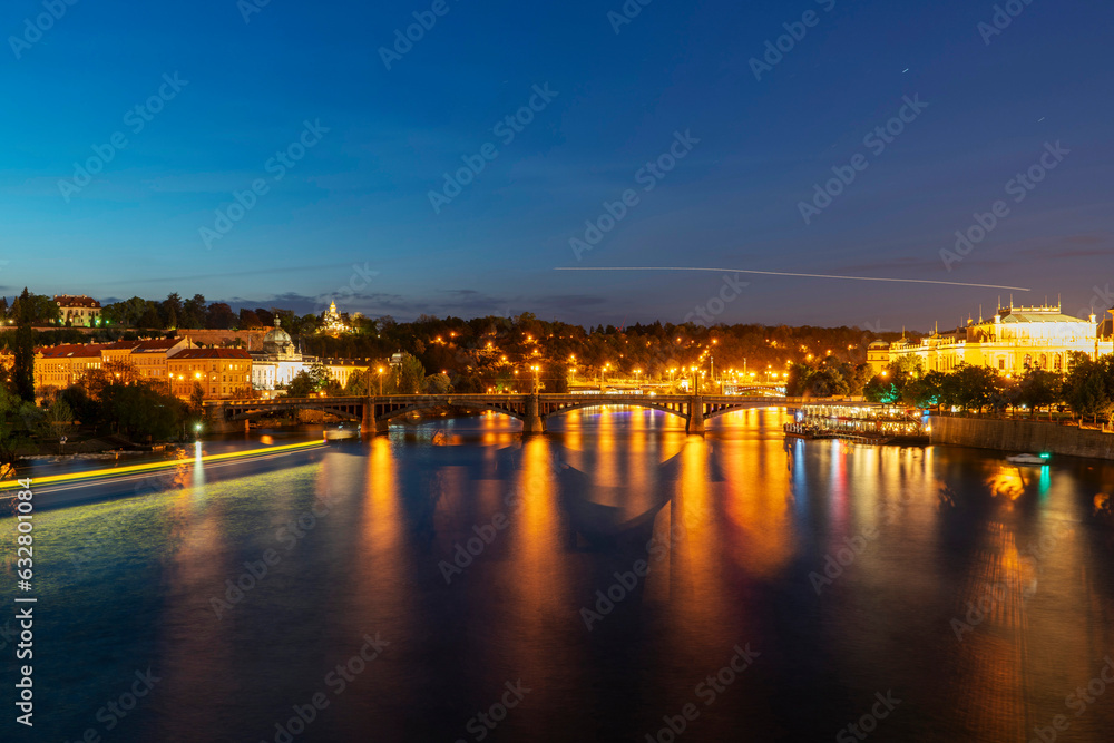 night view of Prague with Manes Bridge and the Czech Philharmonic, Czech Republic