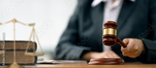 Картината върху платно Female Judge with gavel on table