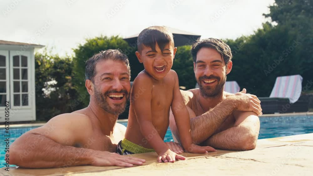 Portrait of same sex family with two Dads having fun with son in
