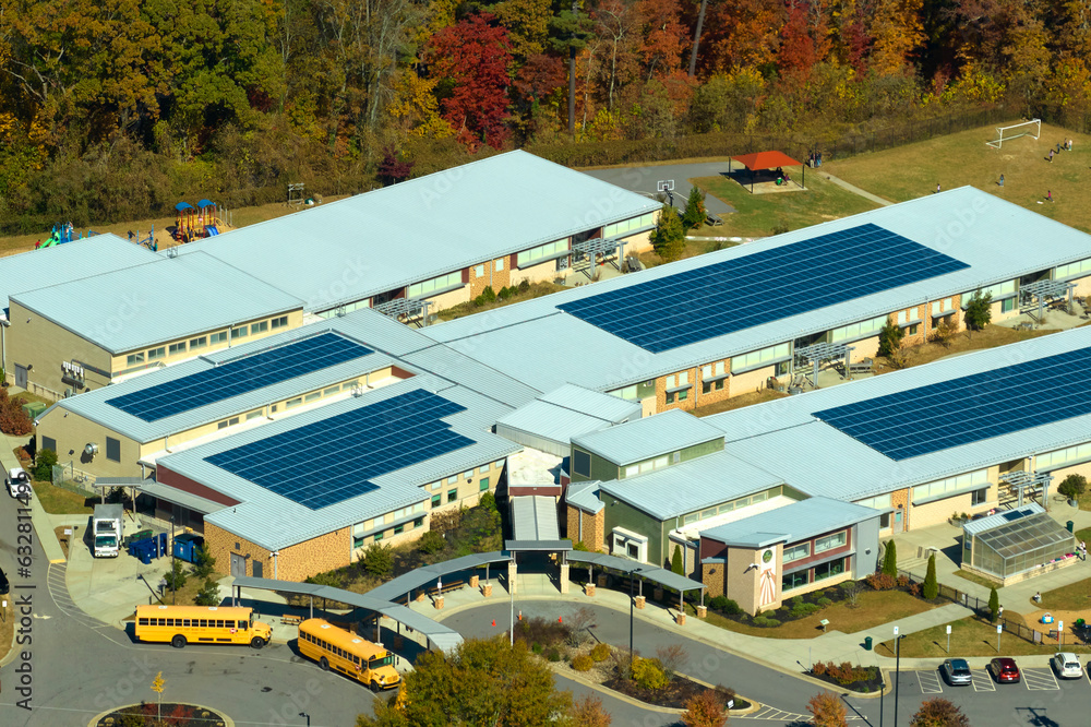 Aerial view of american school building with rooftop covered with ...