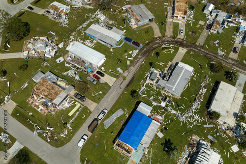 Aerial view of natural disaster consequences in Florida Southwest region. Severely damaged by hurricane Ian mobile homes in residential area