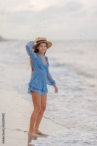 Happy girl enjoy summer vacation on the beach