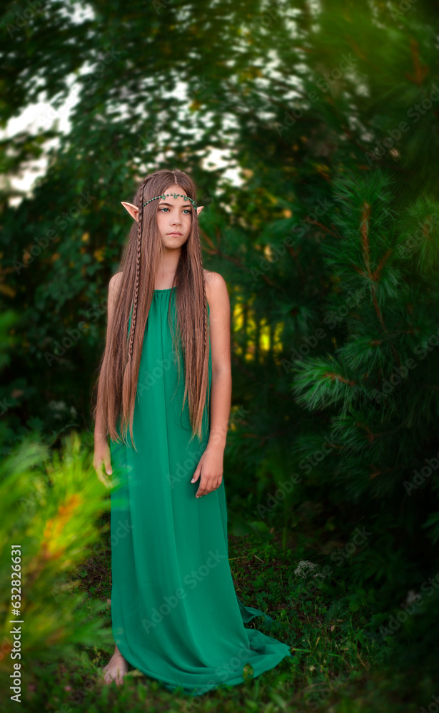 Beautiful young girl in the image of an elf in the park. Beautiful young girl in the image of an elf in the park.