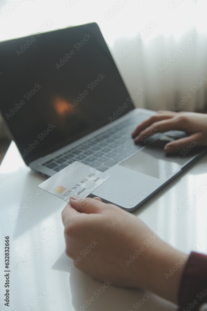 Woman hands holding and using cradit card for shopping online. Woman hands holding and using cradit card for shopping online.