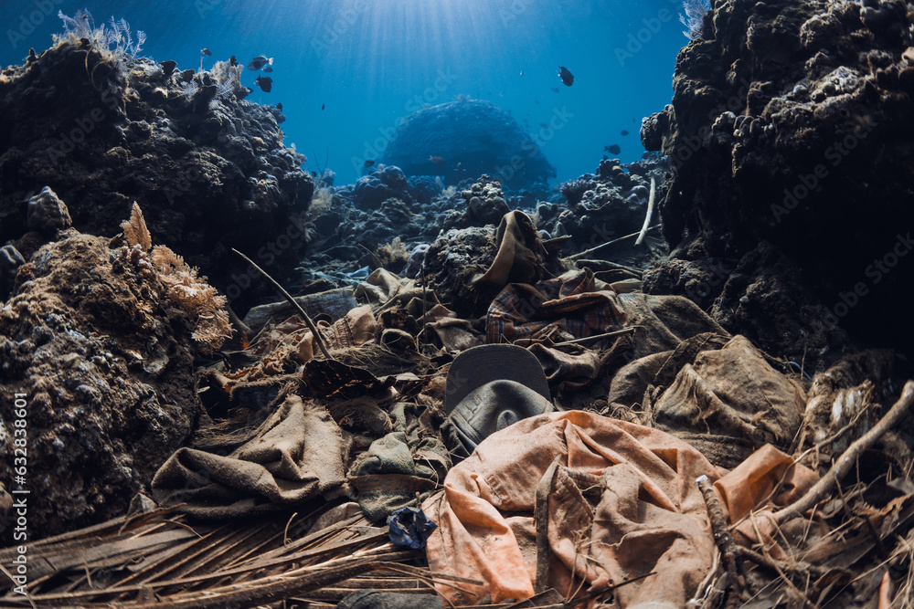 Underwater scene with pollution and corals. Tropical sea with transparent blue water Underwater scene with pollution and corals. Tropical sea with transparent blue water
