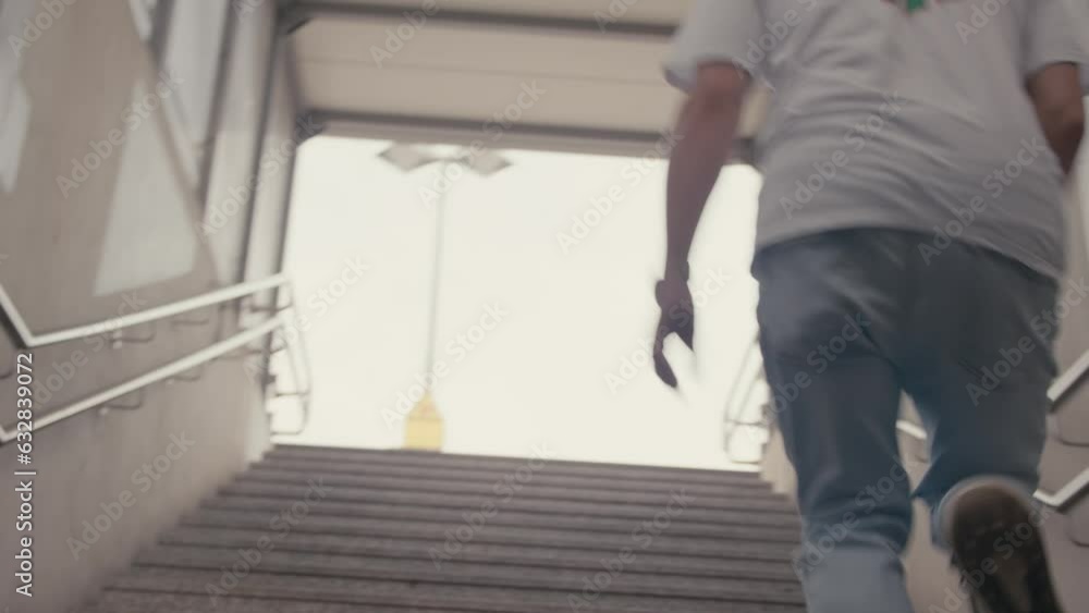 Young Man is Running up Stairs in Cool Sneakers and Jeans, Handheld Young Man is Running up Stairs in Cool Sneakers and Jeans, Handheld