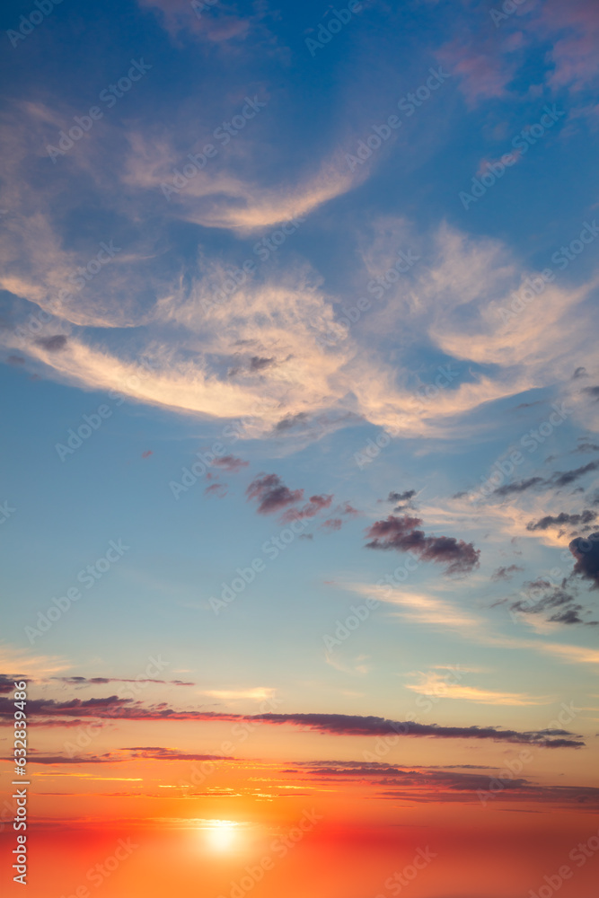 Fototapeta premium Real Sky - Background of Light cirrus clouds in the blue sky during dawn sunset with real sun. Without any birds.
