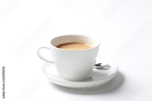 hot drink milk tea , milo , kopi coffee with milk in white cup and tea spoon and small plate in white background beverage halal drink food vegan menu for cafe