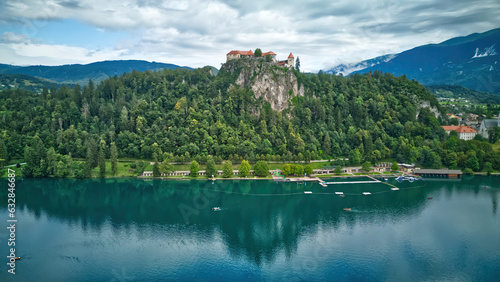 Aerial view of beautiful Bled Castle (Blejski Grad) with Lake Bled (Blejsko Jezero) on a bright summer day - Bled, Slovenia