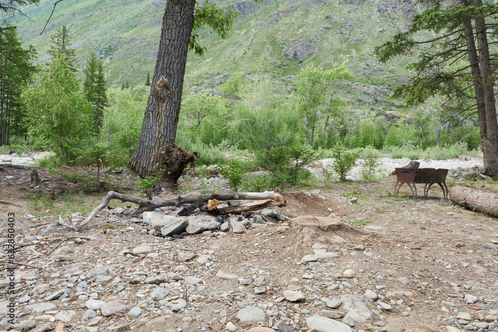 Place for a campfire at the camping site in the Altai Mountains. Place for a campfire at the camping site in the Altai Mountains.