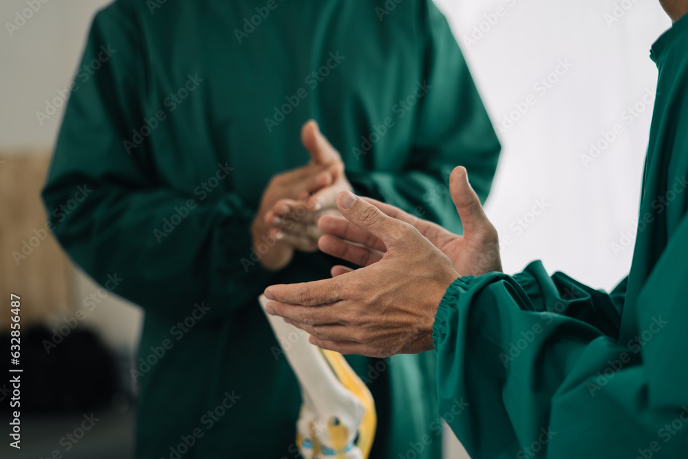 Doctors holding hands together at hospital. Doctors holding hands together at hospital.