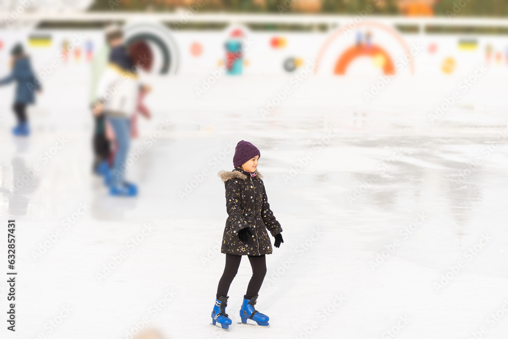 teenage girl skating outdoor, ice rink teenage girl skating outdoor, ice rink
