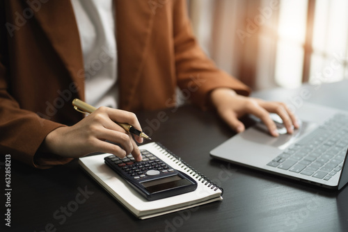 Businessmen are calculating income-expenditure and analyzing real estate investment data at office, Accounting Financial and tax systems concept.