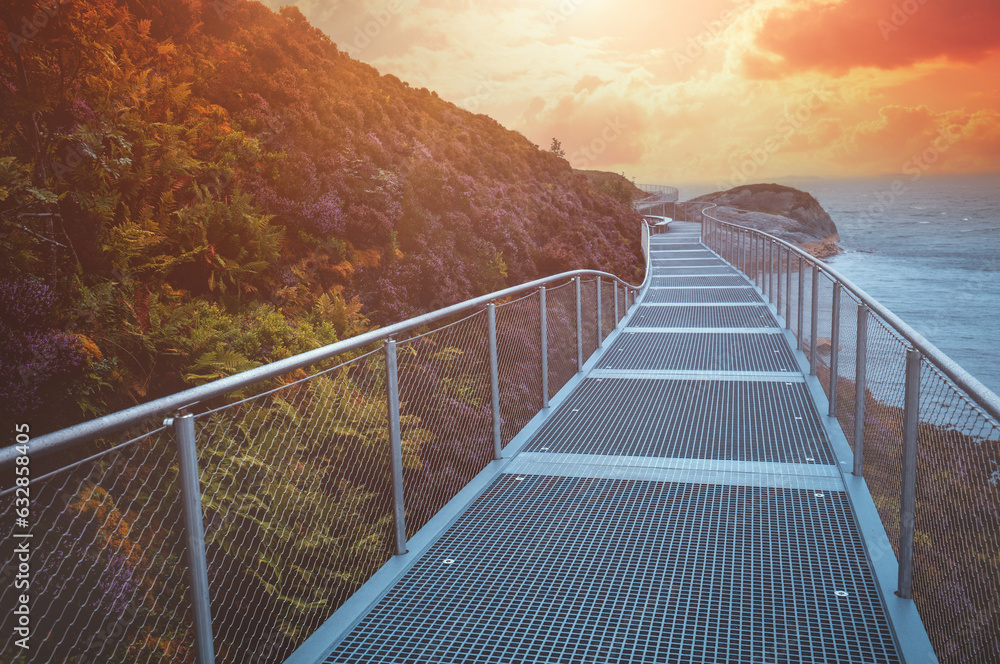 Metal walkway on the mount along the sea in autumn. Norway, Europe