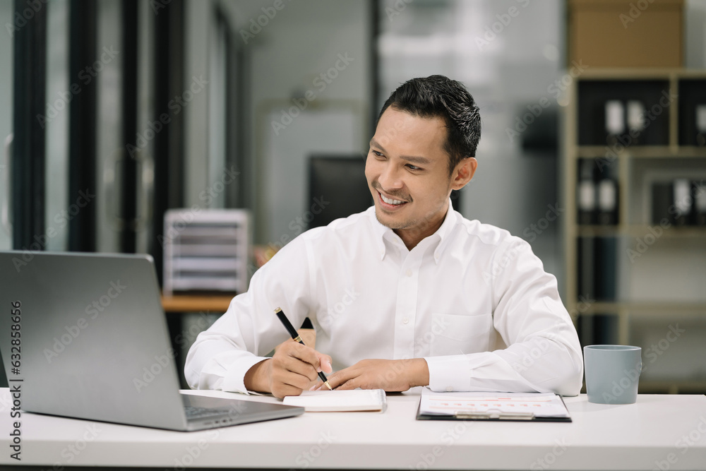 Business man working at office with laptop and documents on his desk, financial adviser analyzing data. Business man working at office with laptop and documents on his desk, financial adviser analyzing data.