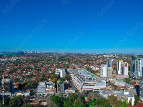 Fototapeta Naklejka Na Ścianę i Meble -  Drone view looking down on Commercial Suburb of Burwood in Sydney residential houses in suburbia suburban house roof tops and streets park NSW Australia 