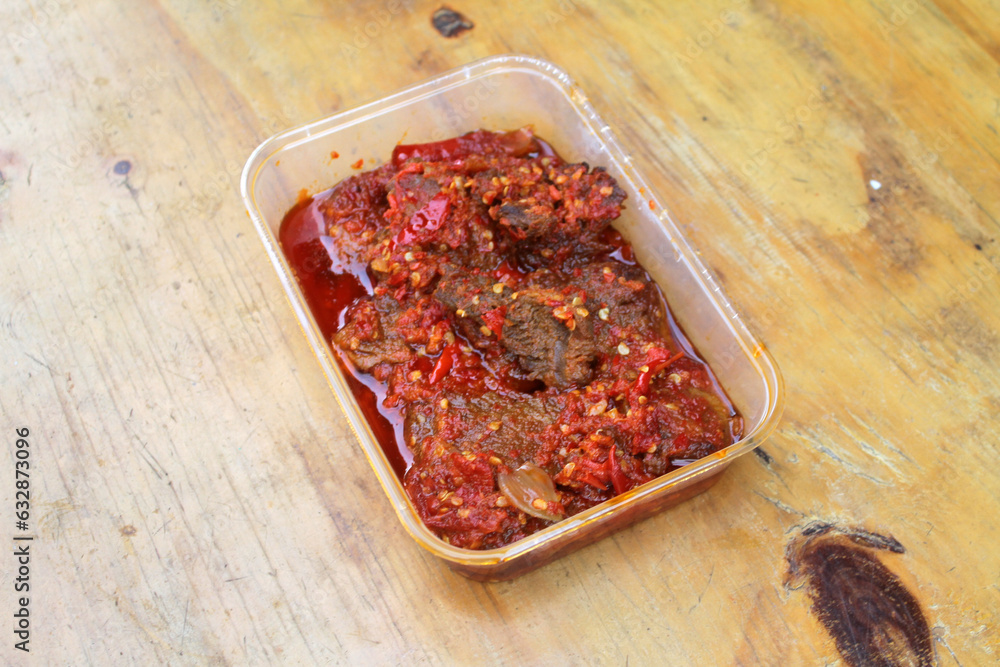Dendeng Balado or Dendeng Batokok, and is a speciality from Padang, West Sumatra, Indonesia. Made from beef which is thinly cut then dried and fried before adding chillies and other ingredients
Dendeng Balado or Dendeng Batokok, and is a speciality from Padang, West Sumatra, Indonesia. Made from beef which is thinly cut then dried and fried before adding chillies and other ingredients