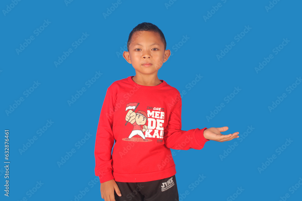 Asian boy wearing independence clothes with arms raised and open Asian boy wearing independence clothes with arms raised and open