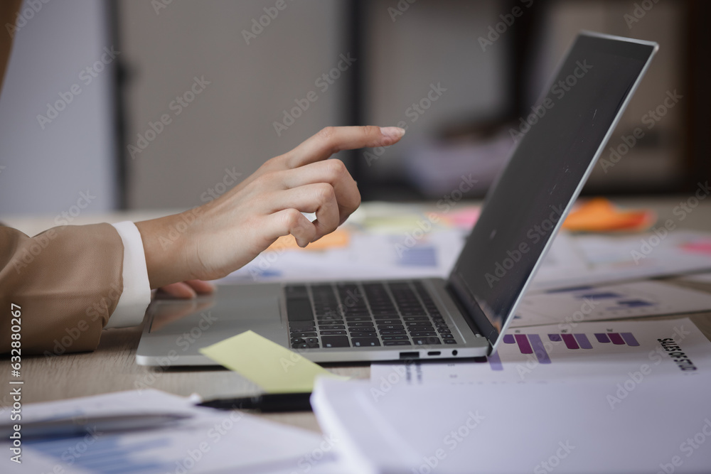 Business hands using laptop computer with document analysis data statistics on office desk. business documents and graph financial diagram. Business hands using laptop computer with document analysis data statistics on office desk. business documents and graph financial diagram.