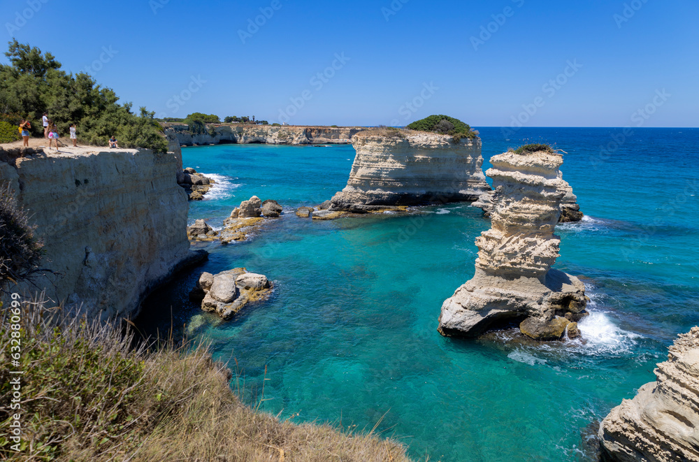 MELENDUGNO, ITALY, JULY 13, 2022 - The cliffs and stacks of Sant'Andrea in Melendugno, region of Salento, province of Lecce, Puglia, Italy