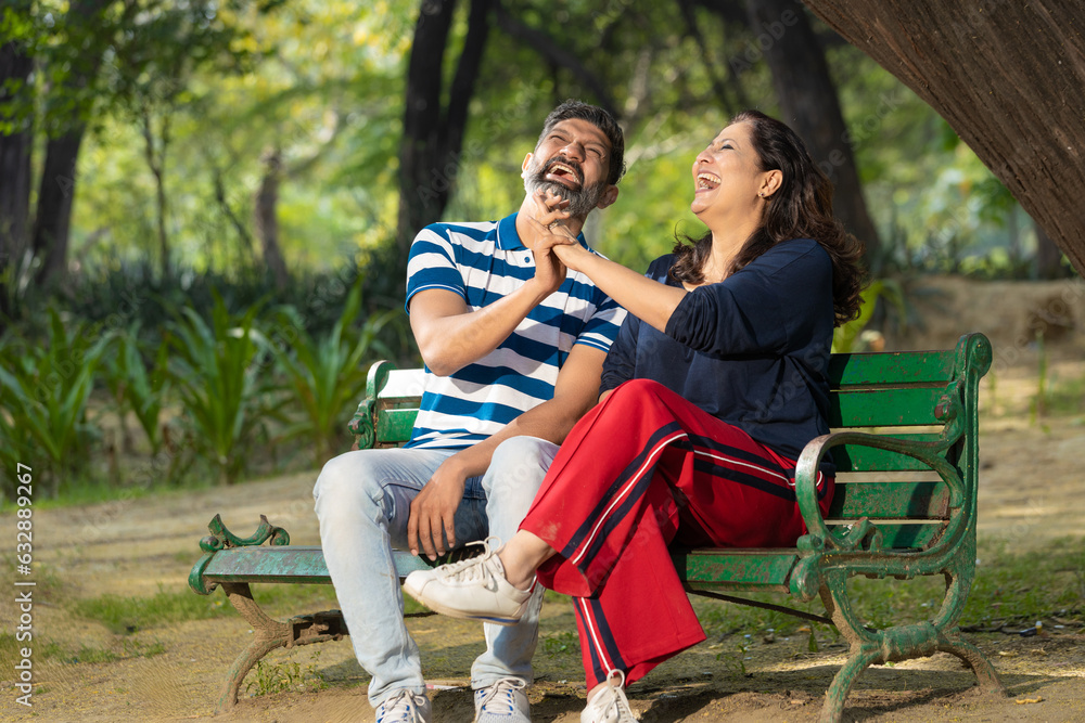Indian couple laughing and giving happy expression. Indian couple laughing and giving happy expression.