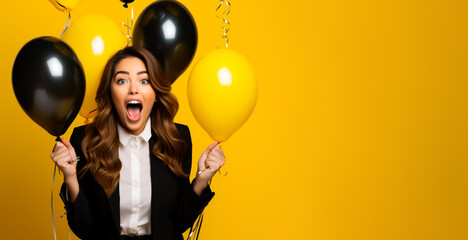 Amazed Woman with black and yellow Balloons on a yellow background. Black Friday or Cyber Monday Sale Banner with copy space.