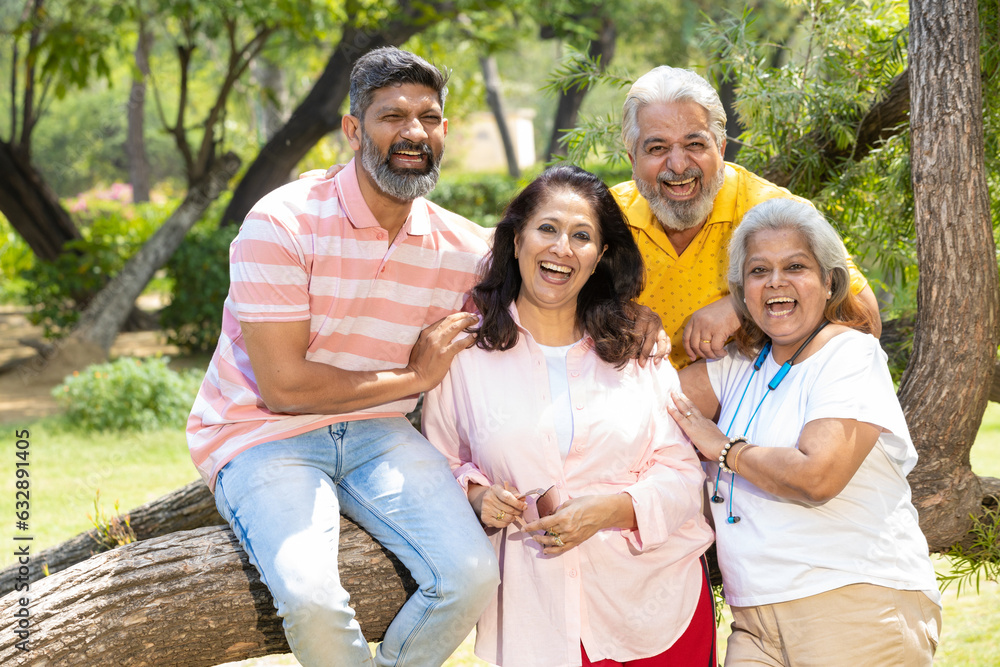 Indian family giving happy expression at park. Indian family giving happy expression at park.