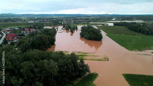 Horrific Aerial 4K Drone footage of flooded villages in Podravje, Slovenia, during August. The  powerful Drava River causing extensive floods. All shots were taken during the day, in cloudy weather. photo