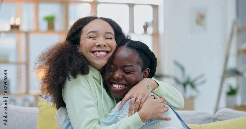 Happy lesbian women, hug and sofa in home with kindness, care or laughing with love, excited or romance. Young gay couple, comic embrace and conversation with smile, reunion and pride on lounge couch Happy lesbian women, hug and sofa in home with kindness, care or laughing with love, excited or romance. Young gay couple, comic embrace and conversation with smile, reunion and pride on lounge couch