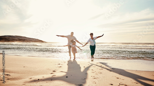 Family  running and freedom on beach with sunshine  happiness and fun together  games and bonding on vacation. Travel  adventure and playful  parents and child  happy people in nature with energy