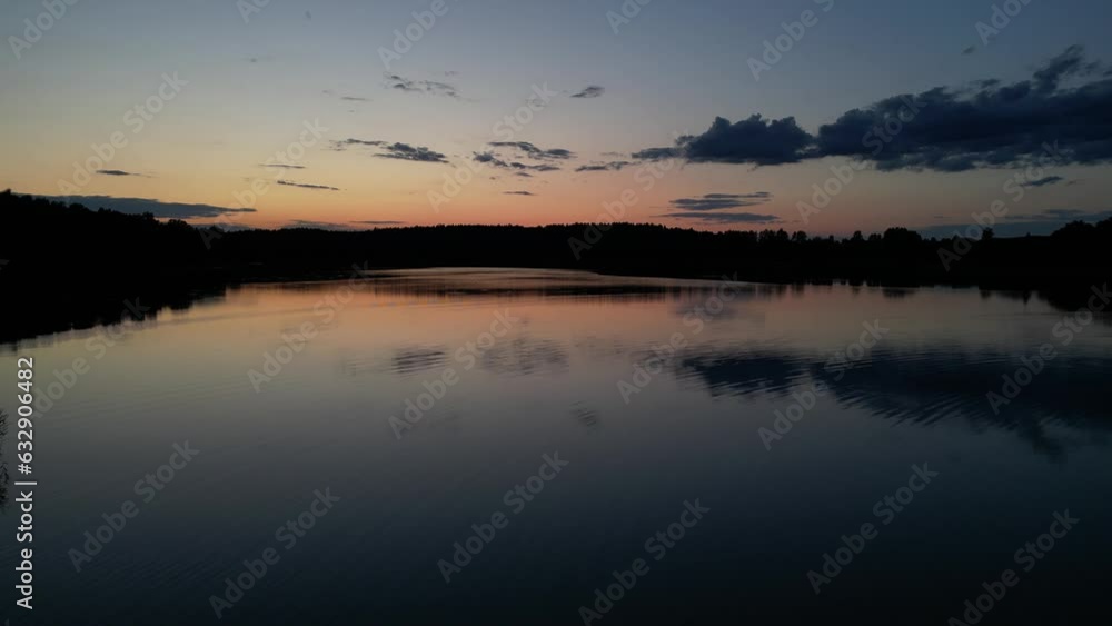 romantic sunset over a calm lake - drone view romantic sunset over a calm lake - drone view