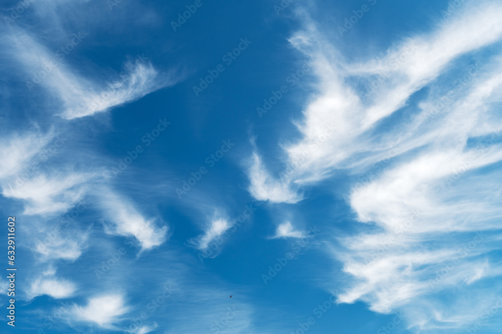 Beautiful blue sky with gentle white clouds. Aerial background view from of clear blue skies and white faint clouds